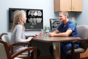 Patients love to review their X-rays on the 46-inch TV displayed on a wall in the consultation room.