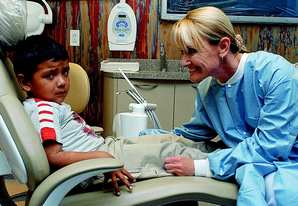 It gets better: Dr. Denise Habjan leans in to comfort an unhappy 5-year-old Valentin Ramirez for dental treatment in one of Tomorrow\'s Dental Office Today\'s two operatories. Dr. Habjan said Valentin